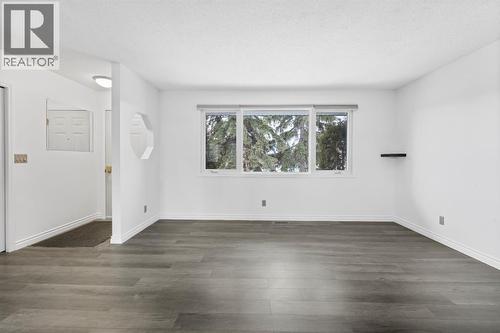 Bright living room with big upgraded windows - 724 Pinecliff Road Ne, Calgary, AB - Indoor Photo Showing Other Room