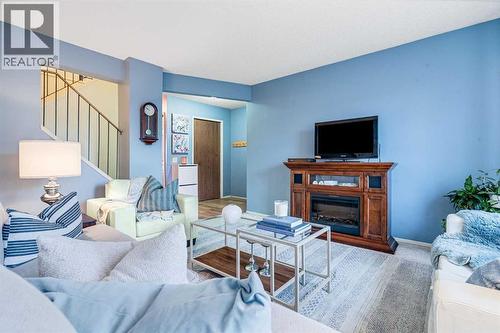 6 Castleglen Road Ne, Calgary, AB - Indoor Photo Showing Living Room With Fireplace