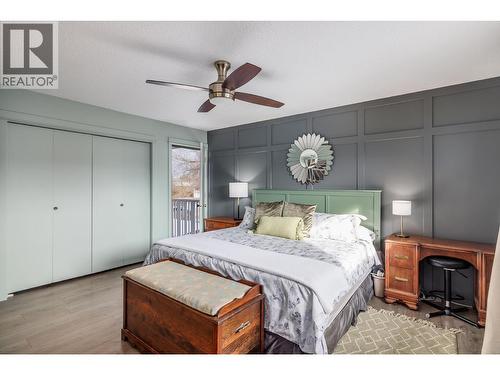 Please note the door to the left of the primary bedroom. It leads to the side deck where you can enjoy your morning coffee - 865 Theodora Road, Kelowna, BC - Indoor Photo Showing Bedroom