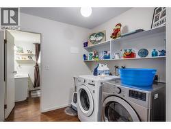Wonderful laundry room off of bathroom located in suite - 