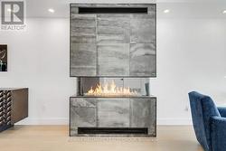 (3-sided gas fireplace with imported tile facade) - 