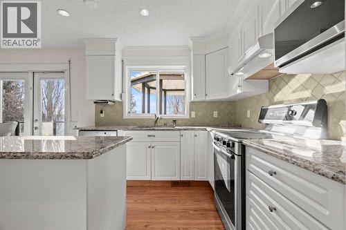 63 Springbank Crescent Sw, Calgary, AB - Indoor Photo Showing Kitchen With Upgraded Kitchen