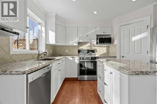 63 Springbank Crescent Sw, Calgary, AB - Indoor Photo Showing Kitchen With Upgraded Kitchen