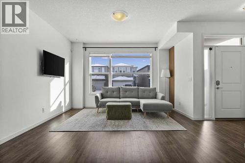 Family room - 59 Wolf Hollow Way Se, Calgary, AB - Indoor Photo Showing Living Room
