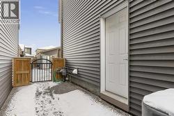 The side entrance creates a practical transition to the lower level, adding functional flexibility to the home - 