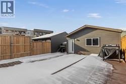 The fully fenced backyard offers a private outdoor setting with access to the detached garage - 