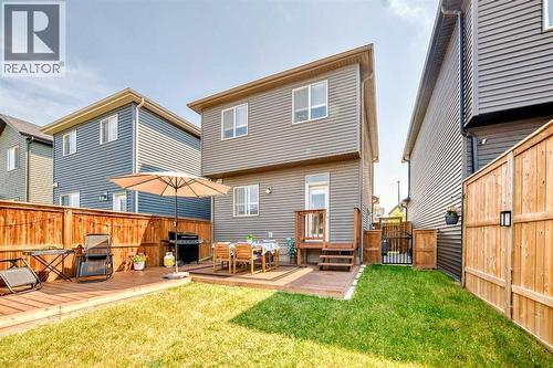 The expansive deck offers multiple seating zones, perfect for relaxing or entertaining - 59 Wolf Hollow Way Se, Calgary, AB - Outdoor With Deck Patio Veranda With Exterior