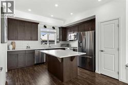 Plenty of storage solutions in the cinammon stained full height cabinetry - 