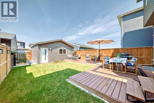 Summer photo of yard - 59 Wolf Hollow Way Se, Calgary, AB - Outdoor With Deck Patio Veranda