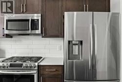 The premium stainless steel appliances highlight this kitchen package.. - 