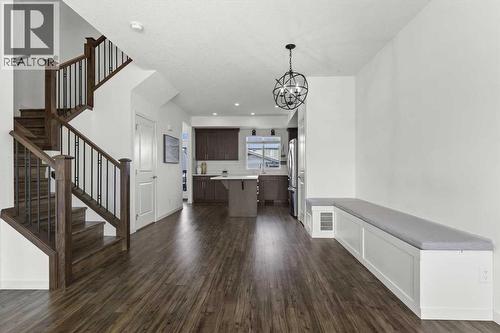 Dining space features a built in nook with custom lighting - 59 Wolf Hollow Way Se, Calgary, AB - Indoor Photo Showing Other Room