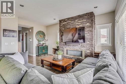 7, 208 Sparrow Hawk Drive, Fort Mcmurray, AB - Indoor Photo Showing Living Room With Fireplace