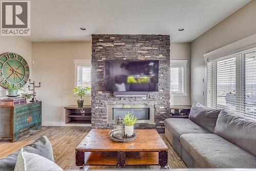 7, 208 Sparrow Hawk Drive, Fort Mcmurray, AB - Indoor Photo Showing Living Room With Fireplace