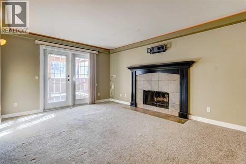 83 Hawkfield Crescent Nw, Calgary, AB - Indoor With Fireplace