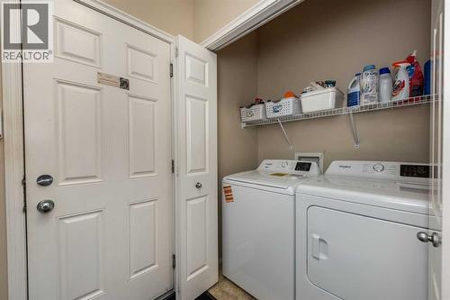 212 Silverado Range Heights Sw, Calgary, AB - Indoor Photo Showing Laundry Room