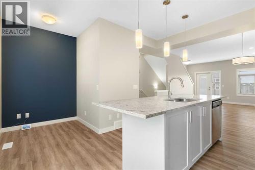 Kitchen with nook for work station - 217 Sage Bluff Drive Nw, Calgary, AB - Indoor Photo Showing Kitchen With Upgraded Kitchen