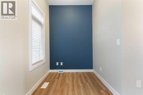 Nook off kitchen for workstation, feature wall - 217 Sage Bluff Drive Nw, Calgary, AB - Indoor Photo Showing Other Room