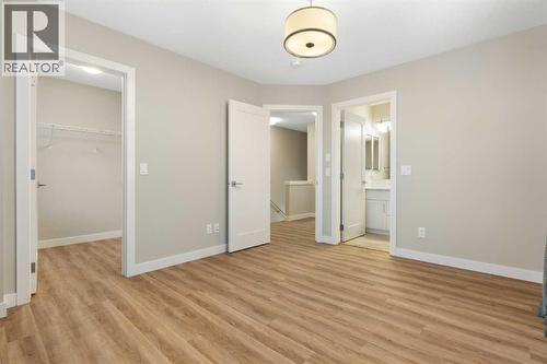 Rear primary bedroom, walk-in closet, 4-piece en-suite - 217 Sage Bluff Drive Nw, Calgary, AB - Indoor Photo Showing Other Room