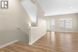 Main level, living room, luxury vinyl plank flooring. 9' knock down ceiling, - 