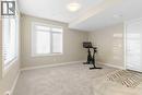 Flex room, 2 large windows - 217 Sage Bluff Drive Nw, Calgary, AB  - Indoor Photo Showing Gym Room 