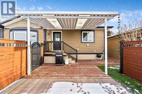 Fully Fenced & Covered Patio - 4 Spring Dale Circle Se, Airdrie, AB - Outdoor With Deck Patio Veranda With Exterior