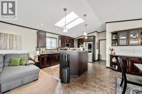 Open Concept Living - 4 Spring Dale Circle Se, Airdrie, AB - Indoor Photo Showing Kitchen