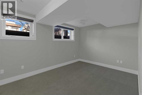Basement bedroom with 2 huge windows - 2319 23 Avenue Sw, Calgary, AB - Indoor Photo Showing Other Room