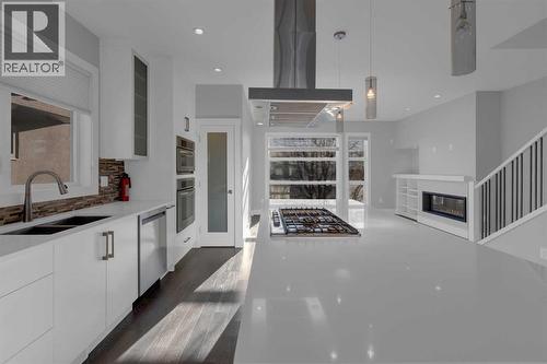 Huge island with quartz countertops - 2319 23 Avenue Sw, Calgary, AB - Indoor Photo Showing Kitchen With Double Sink With Upgraded Kitchen