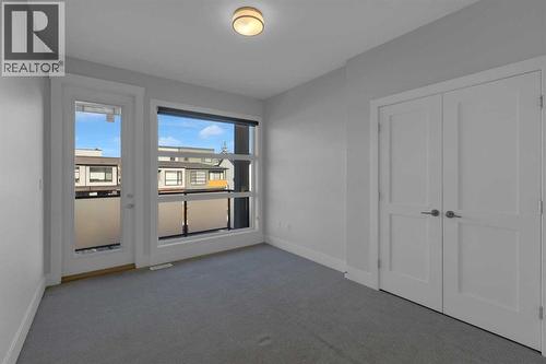 Bedroom 3 with balcony - 2319 23 Avenue Sw, Calgary, AB - Indoor Photo Showing Other Room