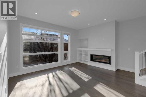 2319 23 Avenue Sw, Calgary, AB - Indoor Photo Showing Living Room With Fireplace