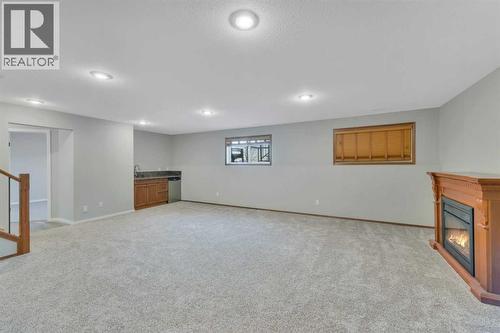132 Illingworth Close, Red Deer, AB - Indoor Photo Showing Other Room With Fireplace