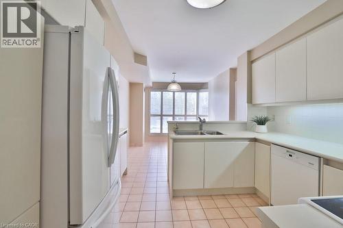 1800 The Collegeway Unit# 211, Mississauga, ON - Indoor Photo Showing Kitchen With Double Sink