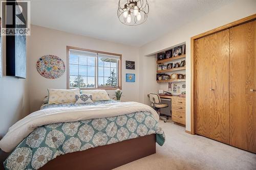 607 9 Street Se, High River, AB - Indoor Photo Showing Bedroom