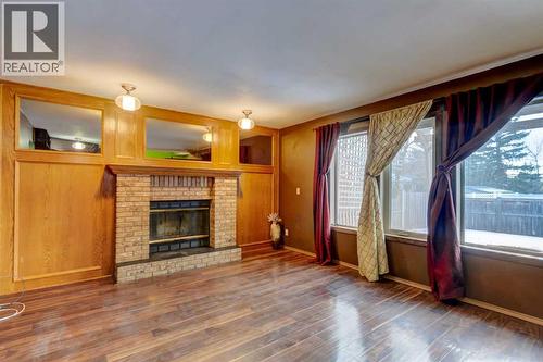 184 Riverbend Drive Se, Calgary, AB - Indoor Photo Showing Living Room With Fireplace