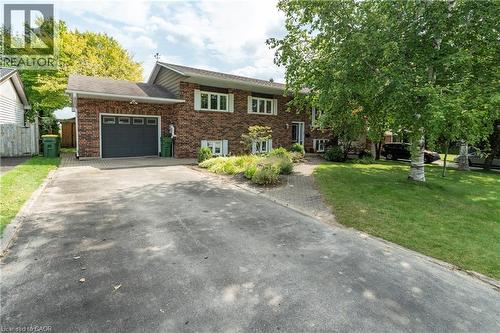 View of front facade featuring a garage, driveway, and brick siding - 29 Armstrong Crescent, Grey Highlands, ON - Outdoor
