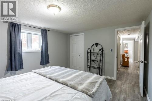 Bedroom with a textured ceiling, wood finished floors, and a closet - 29 Armstrong Crescent, Grey Highlands, ON - Indoor Photo Showing Bedroom