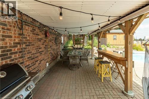 View of patio / terrace featuring outdoor dining space, a grill, and an outdoor pool - 29 Armstrong Crescent, Grey Highlands, ON - Indoor Photo Showing Other Room