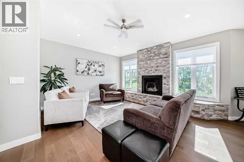 3 - 255049 Township Rd 432, Rural Ponoka County, AB - Indoor Photo Showing Living Room With Fireplace