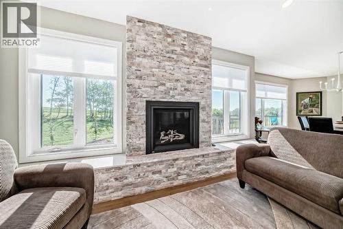 3 - 255049 Township Rd 432, Rural Ponoka County, AB - Indoor Photo Showing Living Room With Fireplace