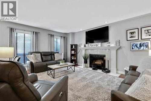 Living Room - 7 Mountain Park Circle Se, Calgary, AB - Indoor Photo Showing Living Room With Fireplace