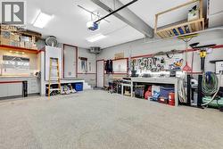Epoxy floors, upper/lower cabinets/Saw table/Sink w/cabinet, TV/Air Compressor w/reel & 50' hose, wainscoting, - 