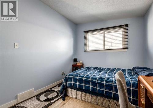 7634 & 7636 22A Street Se, Calgary, AB - Indoor Photo Showing Bedroom