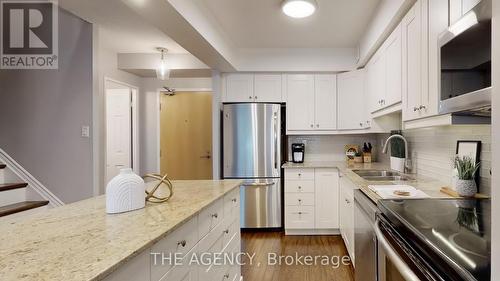119 - 60 Southport Street N, Toronto, ON - Indoor Photo Showing Kitchen With Stainless Steel Kitchen With Double Sink