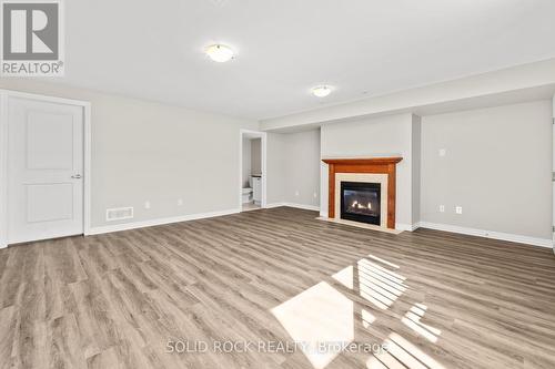 153 Hawkshaw Crescent E, Ottawa, ON - Indoor Photo Showing Living Room With Fireplace