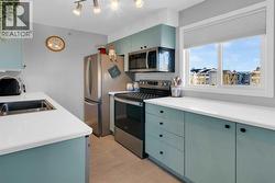 Natural light floods the kitchen too and... you have a view to visitor parking to keep an eye out for guests - 