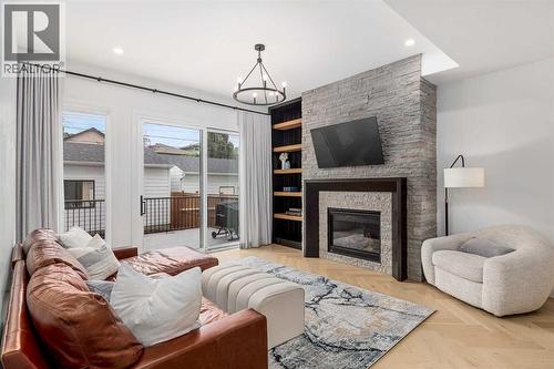 2032 41 Avenue Sw, Calgary, AB - Indoor Photo Showing Living Room With Fireplace