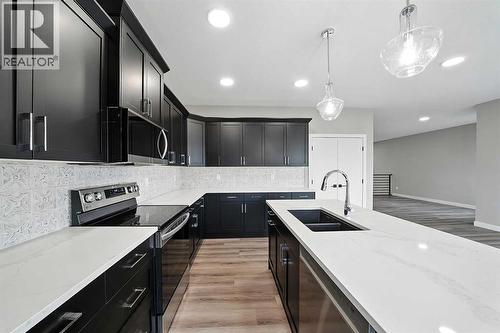 25 Murphy Close, Blackfalds, AB - Indoor Photo Showing Kitchen With Double Sink With Upgraded Kitchen