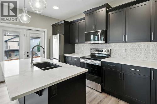 25 Murphy Close, Blackfalds, AB - Indoor Photo Showing Kitchen With Double Sink With Upgraded Kitchen