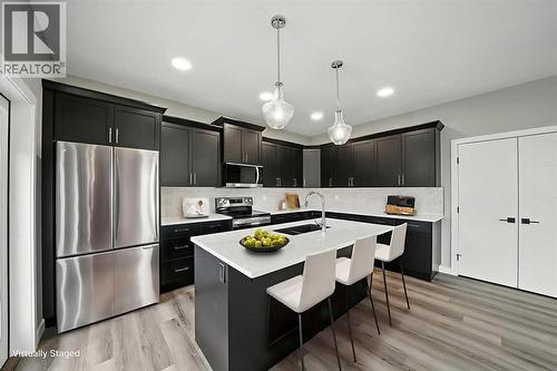 25 Murphy Close, Blackfalds, AB - Indoor Photo Showing Kitchen With Upgraded Kitchen