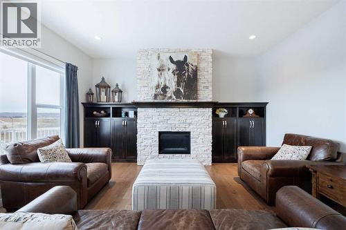 155 Crestridge Hill Sw, Calgary, AB - Indoor Photo Showing Living Room With Fireplace